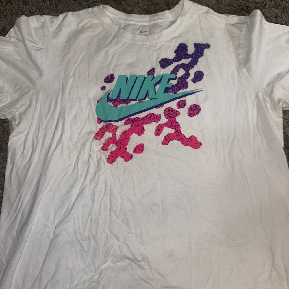 Nike T-shirt. Multi colored with pink, purple, and teal.